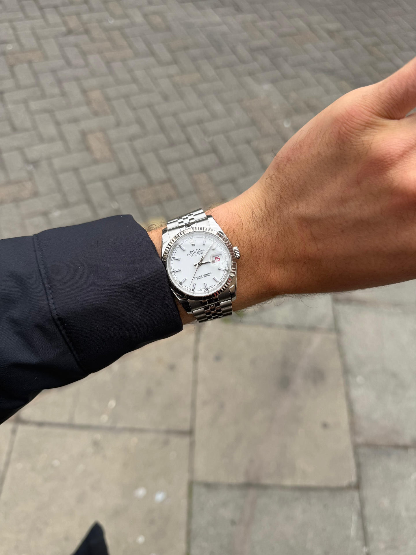 Rolex Datejust 36 white dial on wrist outdoors